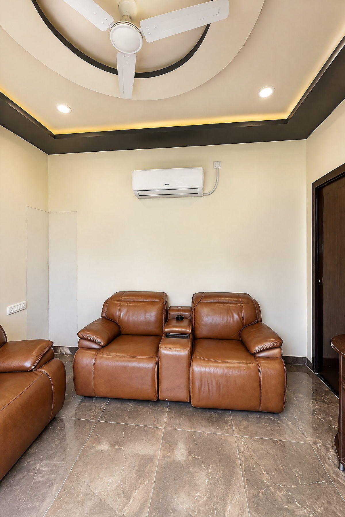 Lounge seating with leather recliners and air conditioning at The White House Pilibhit