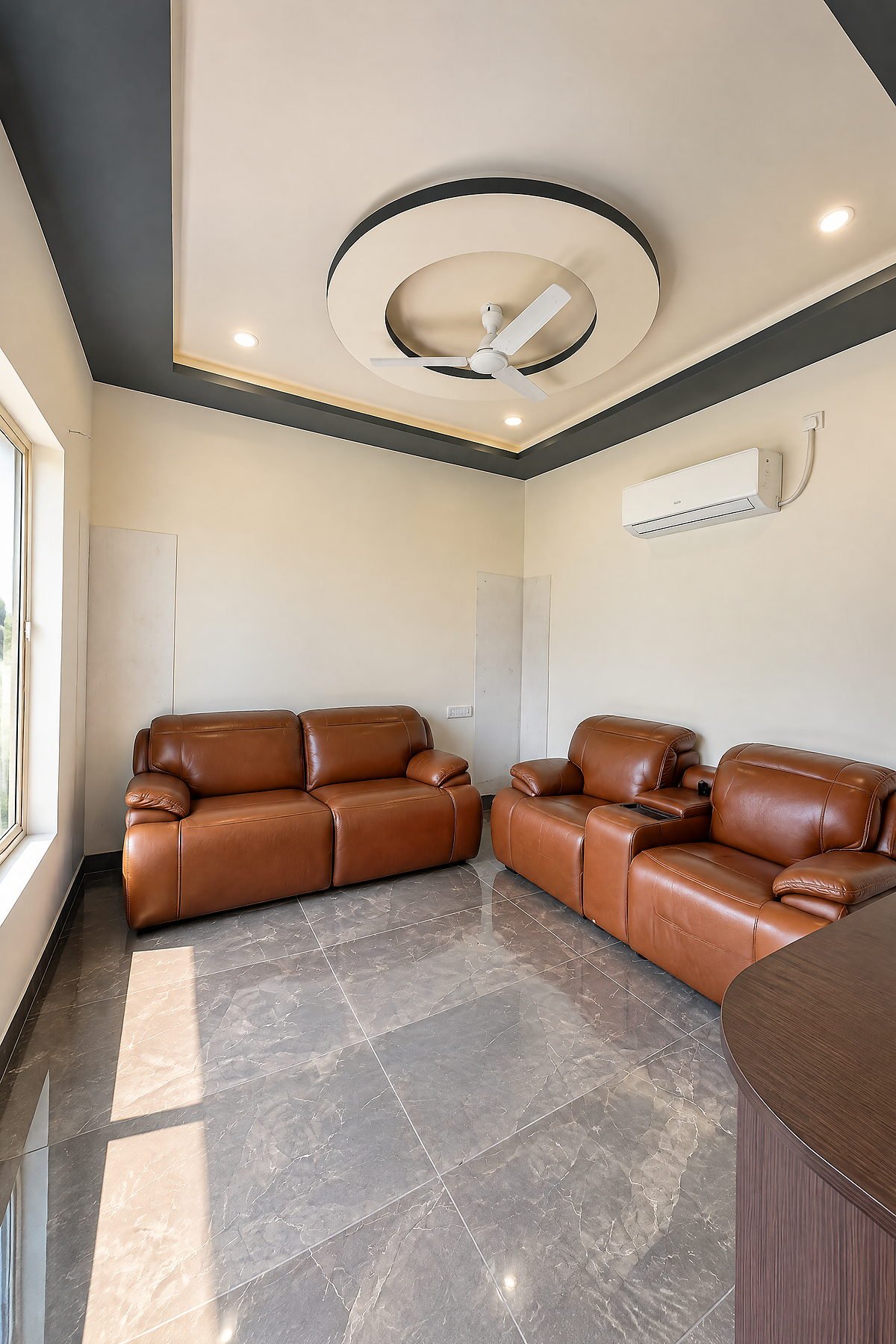 Leather recliner seating in a private lounge space at The White House Pilibhit